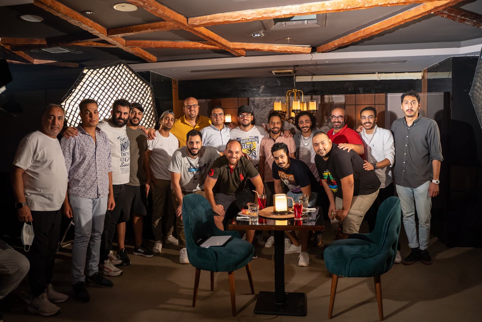 The full production crew posed together on a lit TVC set during the Redmi 10C commercial shoot