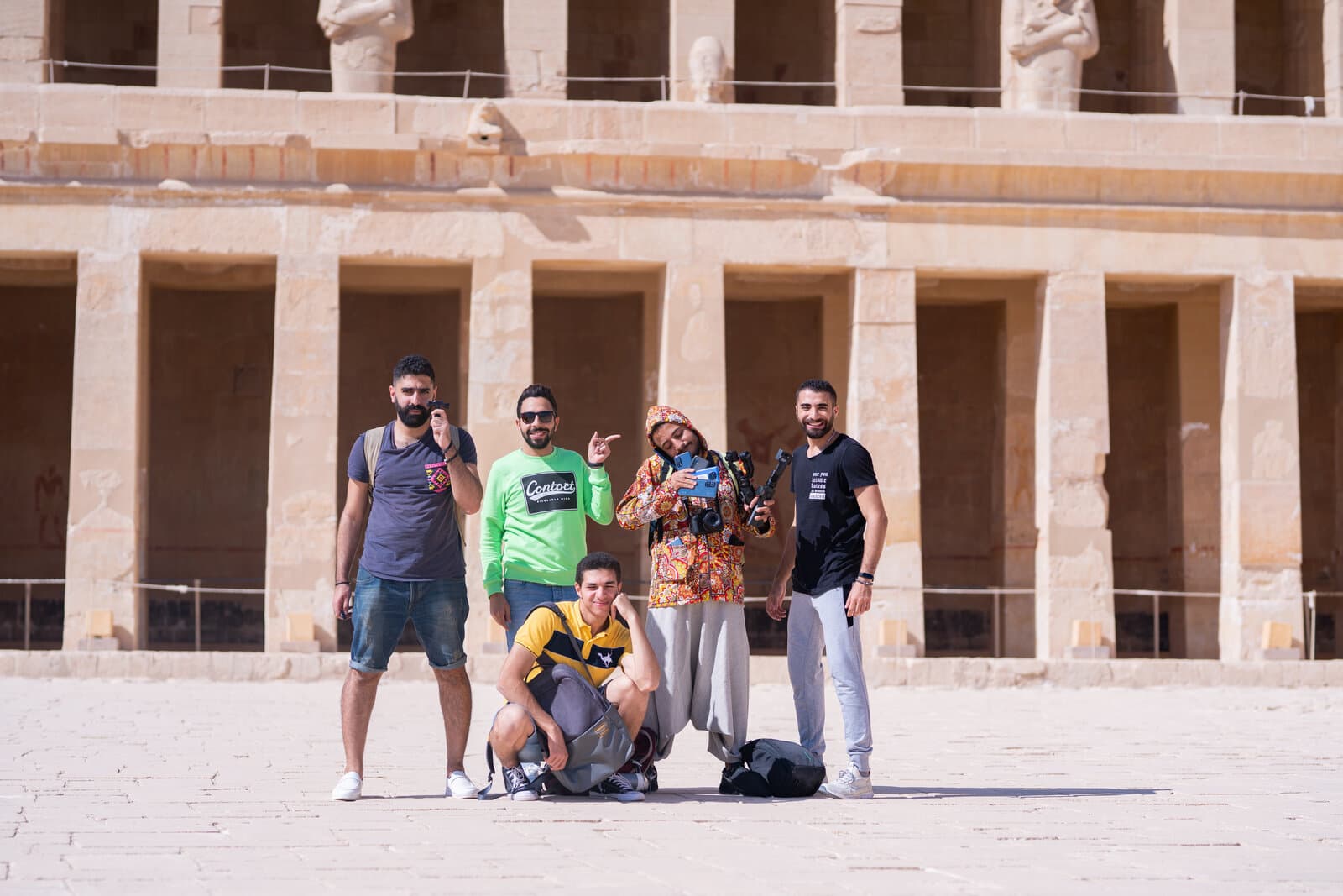 The production crew, cameras and a gimbal in hand, posed in front of Hatshepsut Temple during the 'See Egypt Through Xiaomi's Eyes' shoot